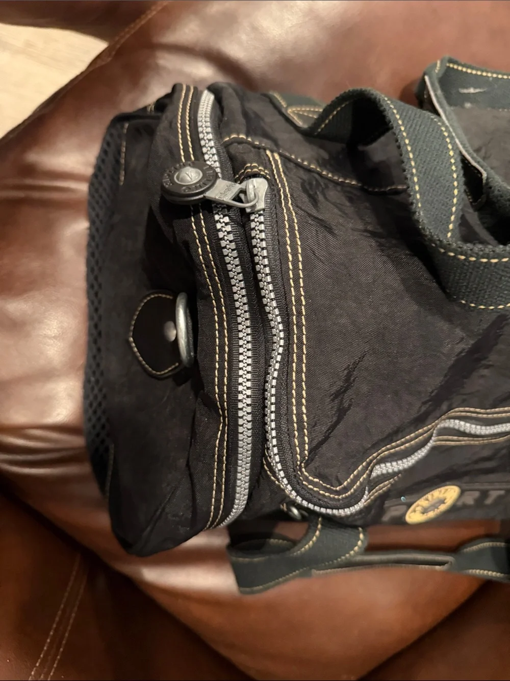 Kipling Black Duffel Bag with Yellow Logo Accent